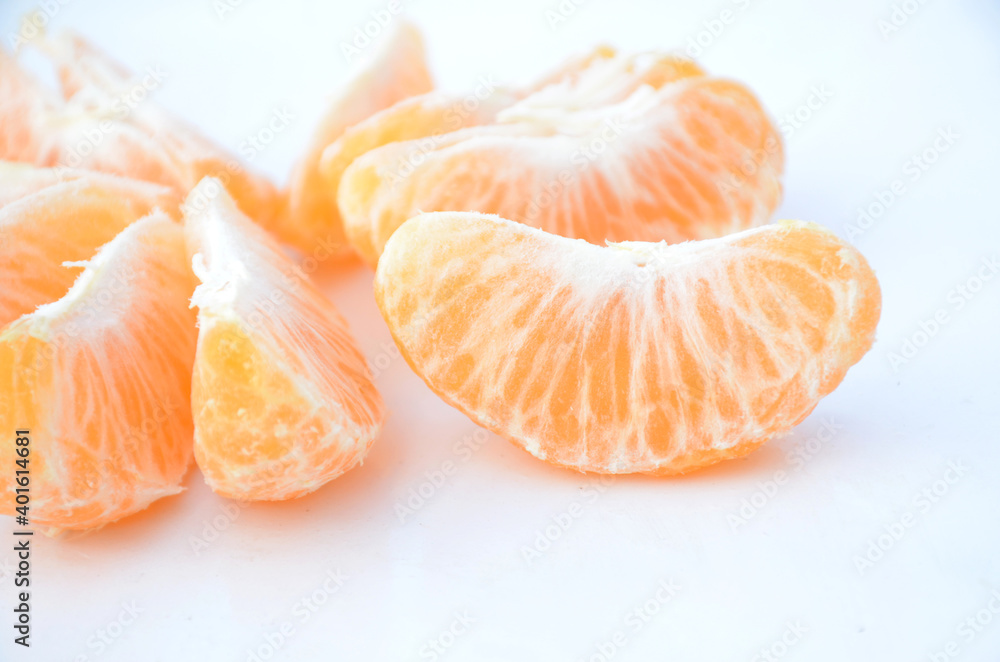 the ripe yellow peels orange isolated on white background. the ripe yellow peels orange isolated on white background.