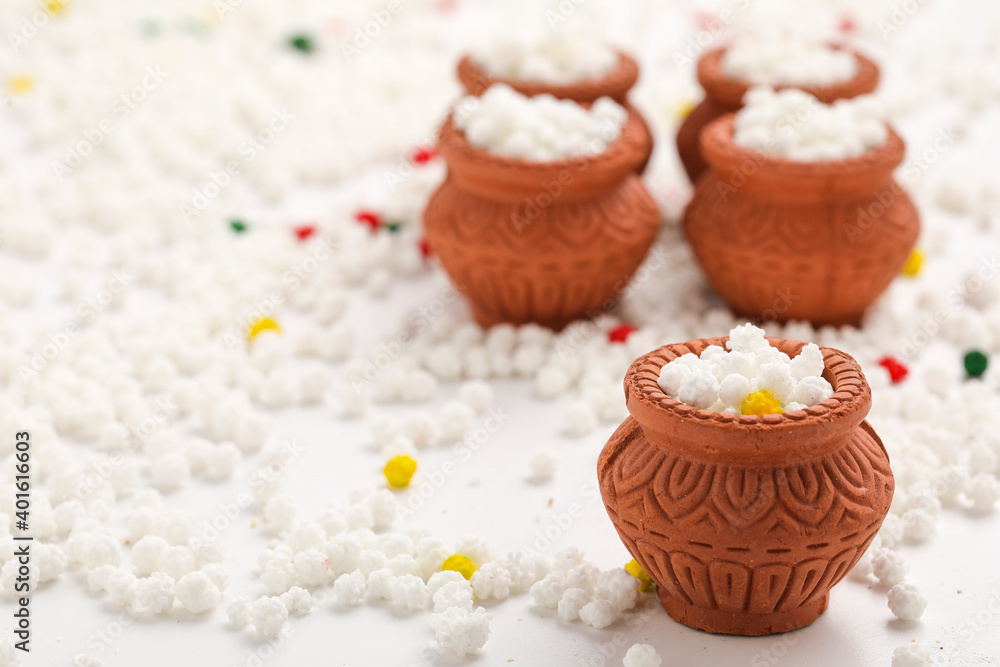 Indian festival makar sankranti concept : Tilgul in small bowl. Tilgul is a colourful sesame candy coated with sesame seeds; in Maharashtra people exchange tilgul on Sankranti