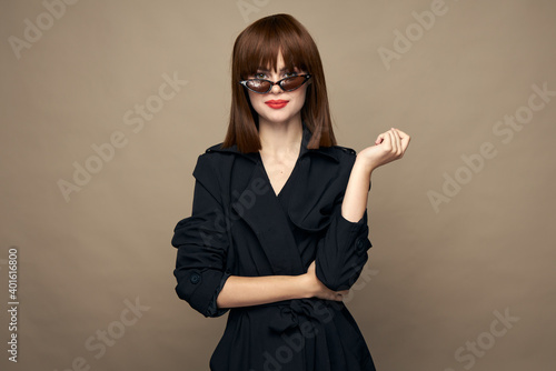 Wallpaper Mural Sexy woman dark coat self-confidence having fun on an isolated background  Torontodigital.ca