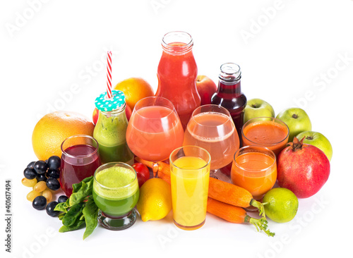 Glasses with various fresh vegetable juices on white