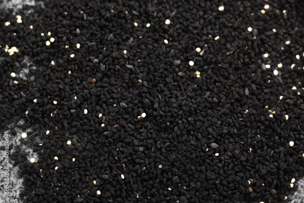 Background of black cumin seeds. Directly Above. Background of black cumin seeds. Directly Above.