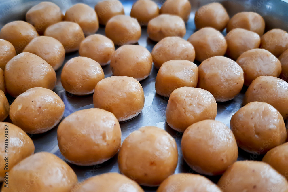 Brown Pera or pedha is an indian sweet made using khoa, sugar and traditional flavorings, including cardamom seeds, pistachio nuts. served in a bowl or plate. selective focus
Brown Pera or pedha is an indian sweet made using khoa, sugar and traditional flavorings, including cardamom seeds, pistachio nuts. served in a bowl or plate. selective focus