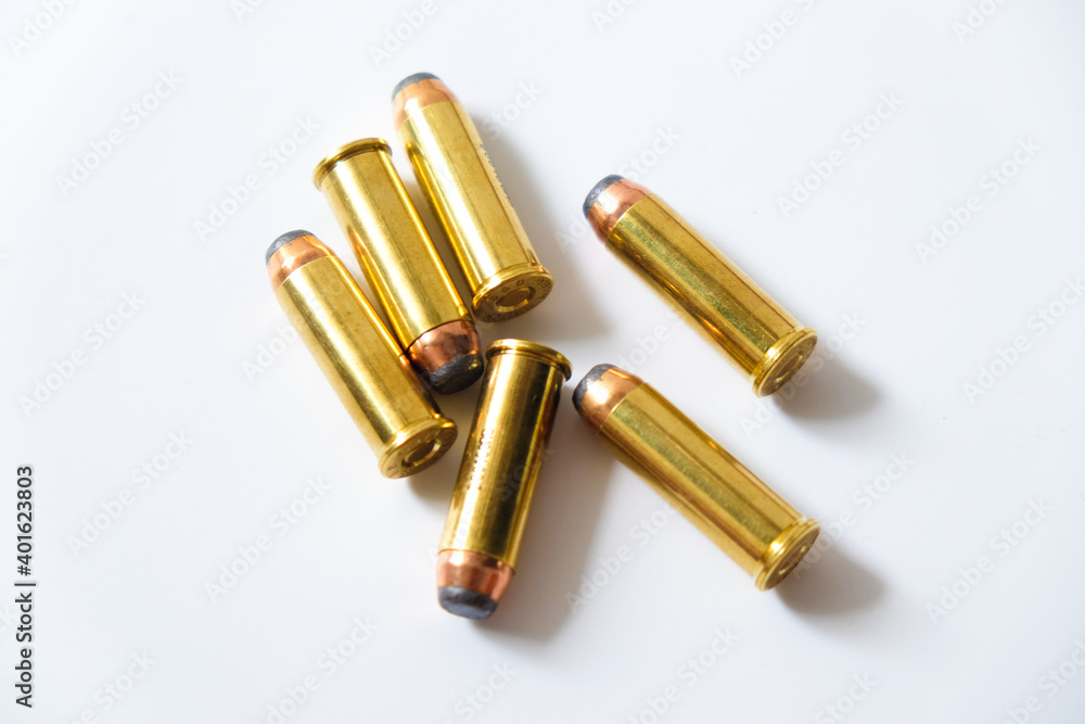Group of pistol bullet .44 magnum 9mm and .45 on white background Group of pistol bullet .44 magnum 9mm and .45 on white background