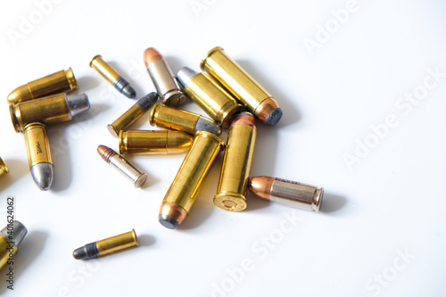 Group of pistol bullet .44 magnum 9mm and .45 on white background
