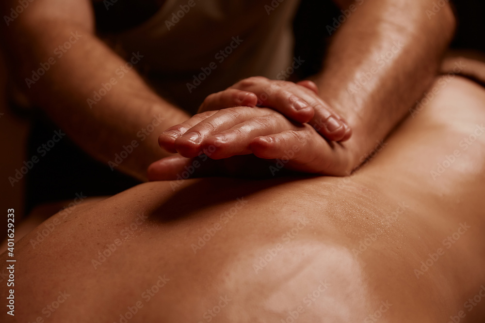 Girl getting back massage. Spa salon - obrazy, fototapety, plakaty 