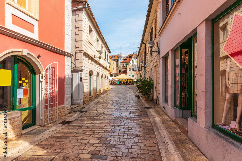 Fototapeta Narrow traditional European Street near the Center square, clock-tower and the old town gate of Herceg Novi, Montenegro
