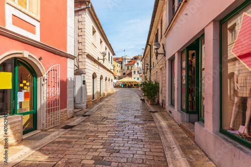 Narrow traditional European Street near the Center square, clock-tower and the old town gate of Herceg Novi, Montenegro © AlexAnton
