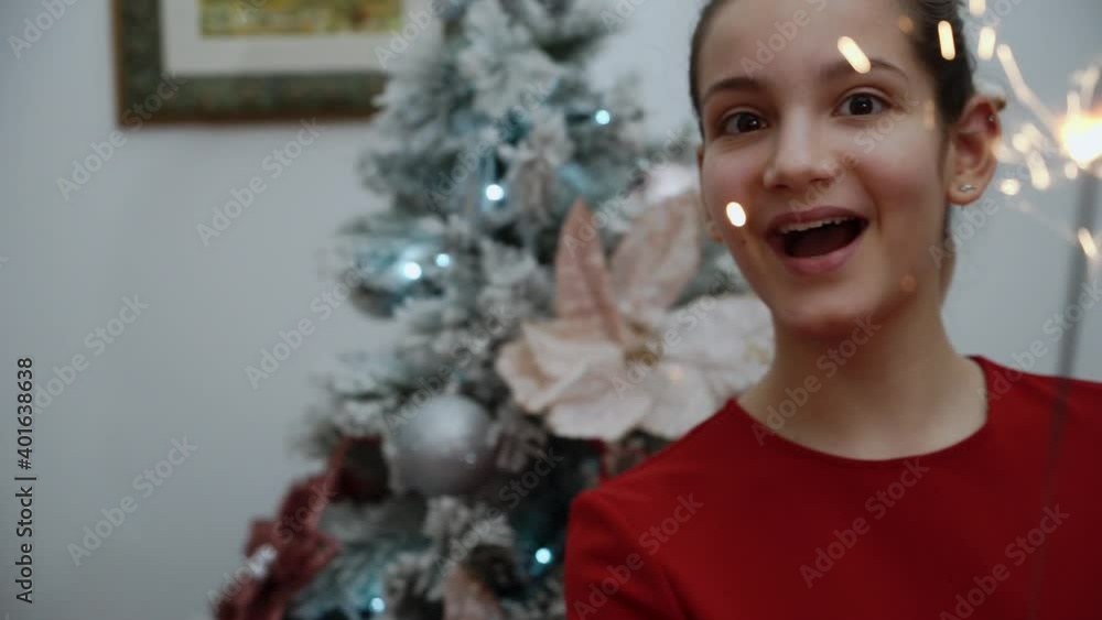 Christmas theme with a teenager girl, in an apartment arranged for the winter holidays. Christmas theme with a teenager girl, in an apartment arranged for the winter holidays.