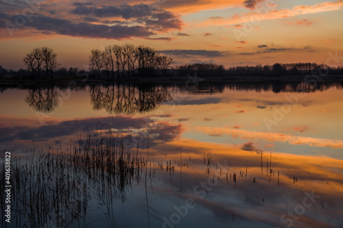 Cute clouds over the lake after sunset