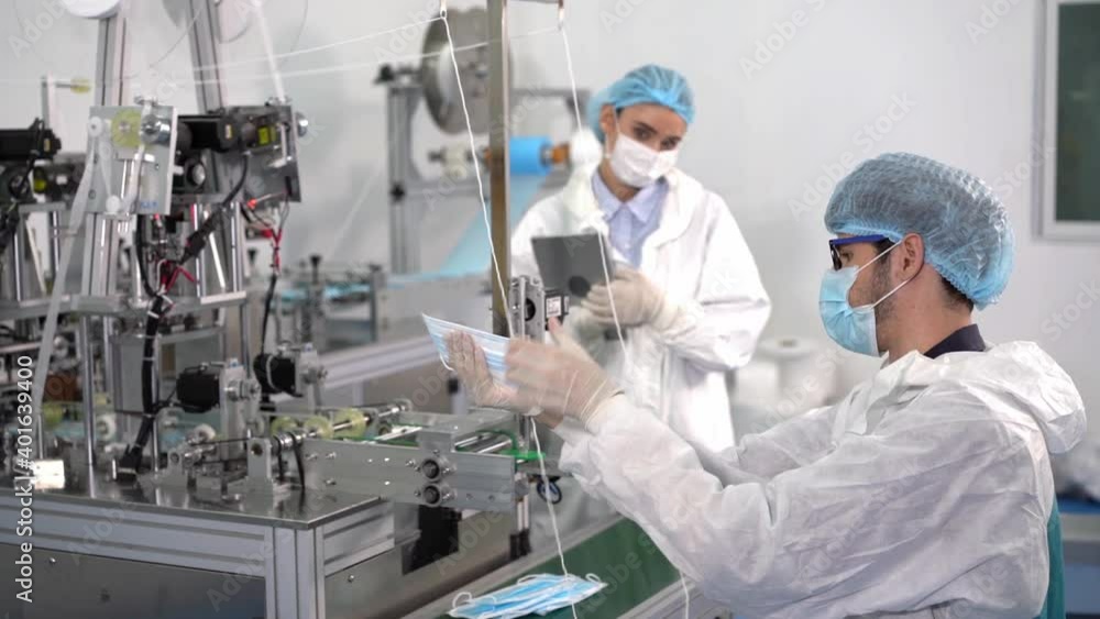 Workers at the mask factory are using machines to produce the required masks during the virus outbreak and dust pollution PM2.5. The workers in the mask factory are checking the product standard. Workers at the mask factory are using machines to produce the required masks during the virus outbreak and dust pollution PM2.5. The workers in the mask factory are checking the product standard.