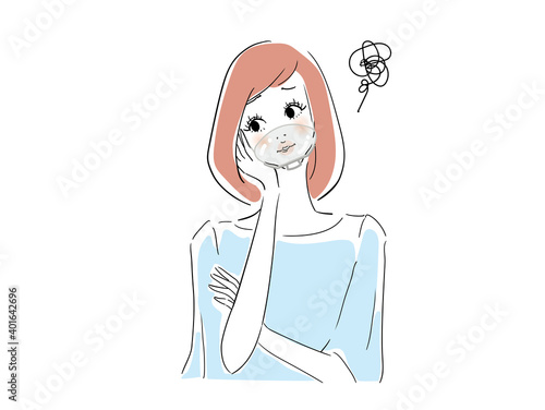 マウスシールドをして困っている女性