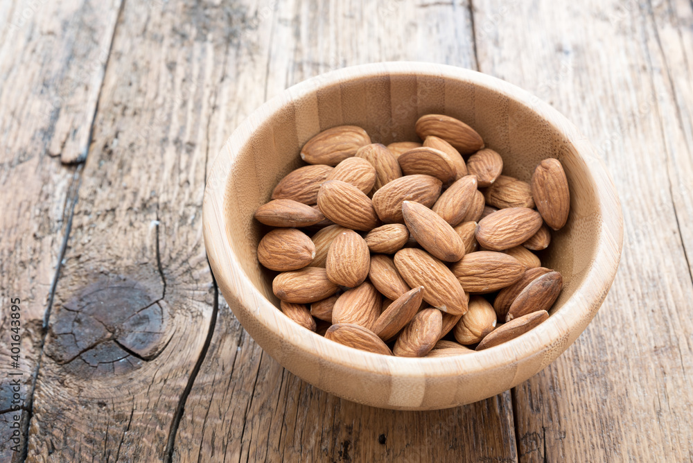 Almonds on the wooden table Almonds on the wooden table