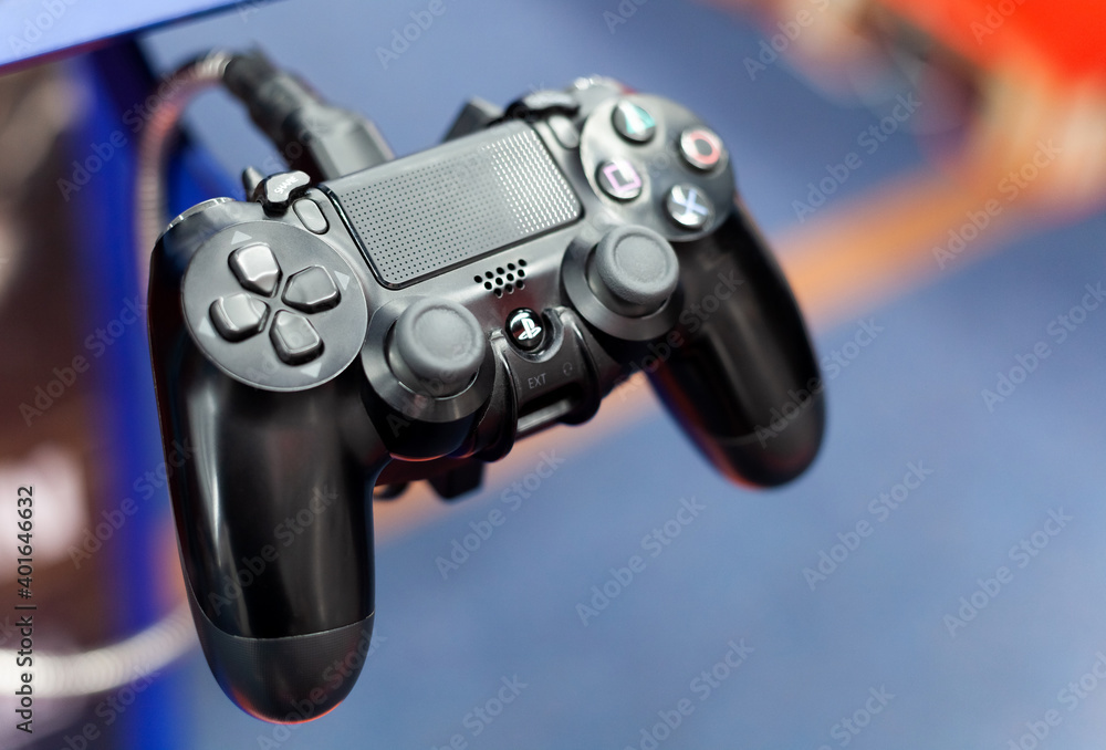 PS4 controller closeup, shallow depth of field. PlayStation 4 pad plugged  in up close. Console gamepad, input devices concept, technology, nobody  Stock Photo | Adobe Stock