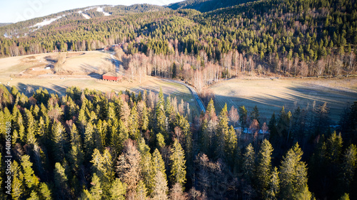 Drone photo shot from the sky. Countryside just outside of Oslo, Norway. Fields and wood mixed together.  photo