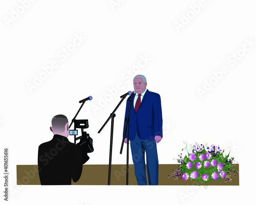 interview of a middle-aged man who stands on stage.