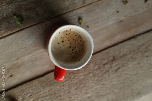 cup of coffee on wooden table