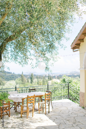 table and chairs in the garden in Corfu , Greece 