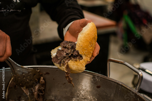 Pane tipico palermitano, pane con la meusa, carne, pentolone photo