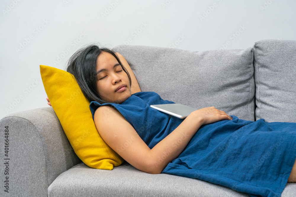 Asian woman sleeping on the sofa at home Asian woman sleeping on the sofa at home