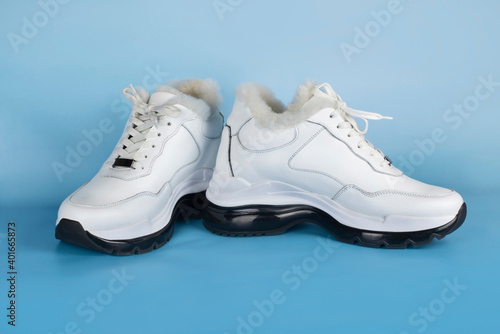 White women's low boots made of leather and fur for winter wet weather, modern shoes for girls and women