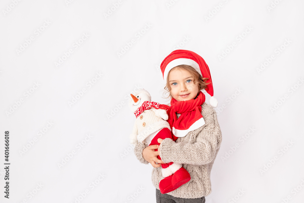 little girl in a Santa hat with a snowman on a white background, space for text little girl in a Santa hat with a snowman on a white background, space for text