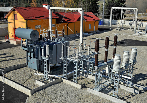 High voltage oil-filled power transformer on electrical substation.Part of high-voltage substation with switches and dis connectors