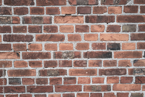  old masonry consisting of bricks serves as background