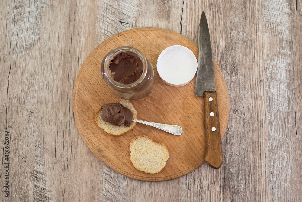 jar of chocolate nut spread and baguette slices jar of chocolate nut spread and baguette slices