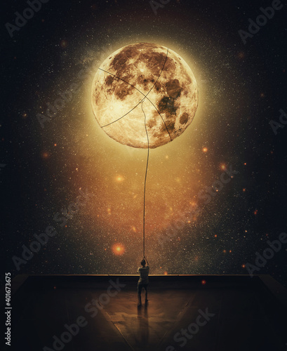 Fotografiet Surreal scene with a person stealing moon from the night sky