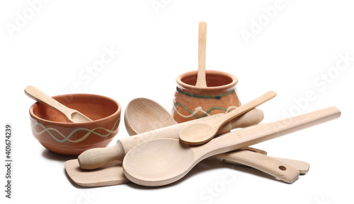 Wooden spoon, ladle, clay pot and rolling pin isolated on white background 