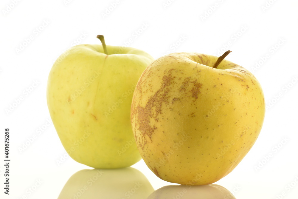 Two fresh yellow apples, close-up, isolated on white. Two fresh yellow apples, close-up, isolated on white.