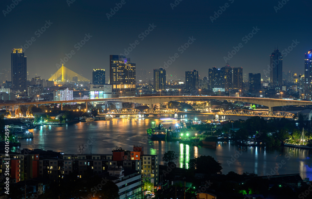 Night view of Bangkok city and Bangkok Bridge over Chao Phraya River