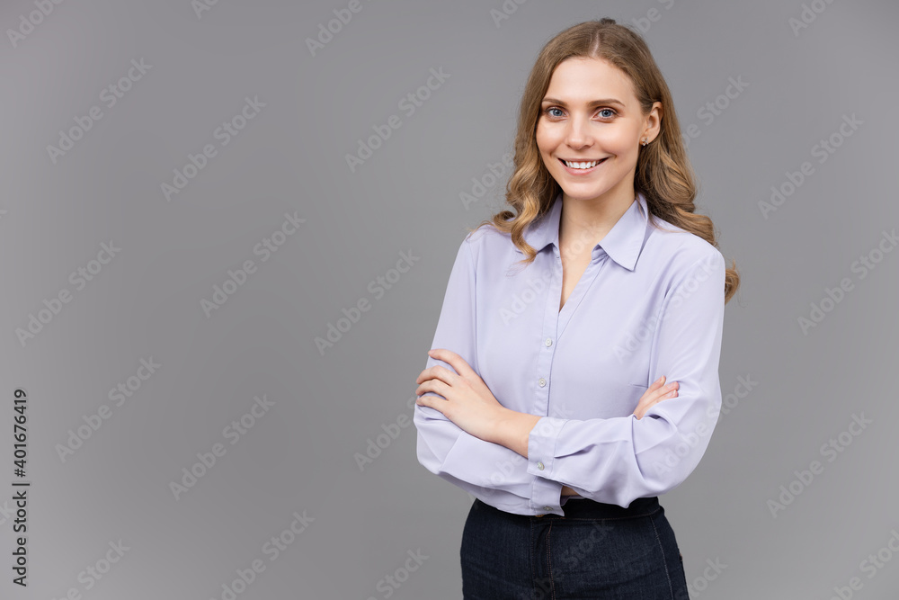 Portrait of a happy young business woman isolated on grey background Portrait of a happy young business woman isolated on grey background