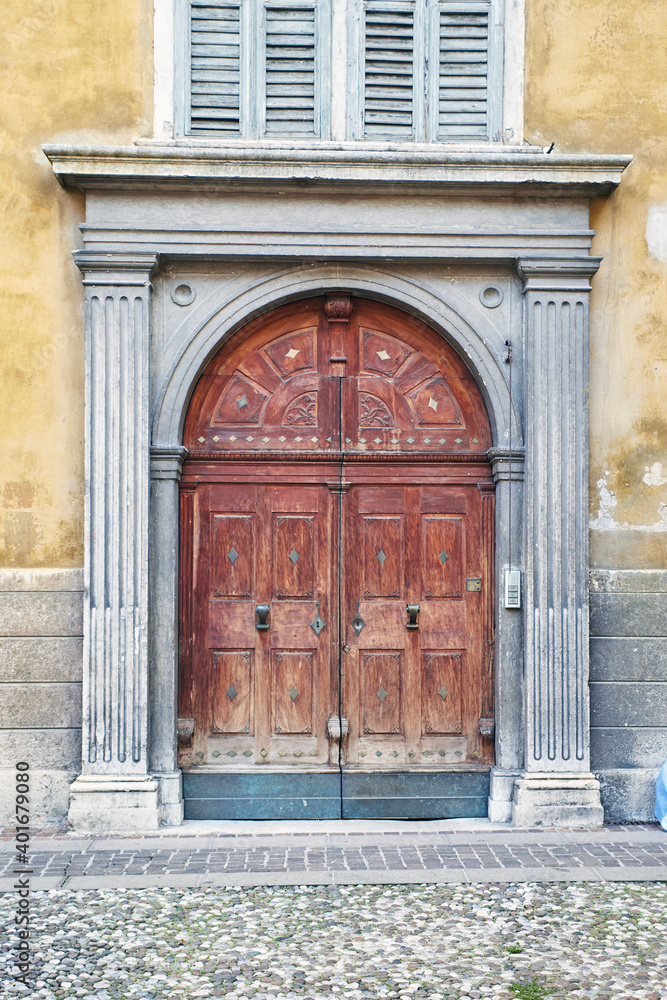 Italian retro wood style front door, element of the classic facade