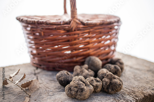 Some black truffles and a basket.