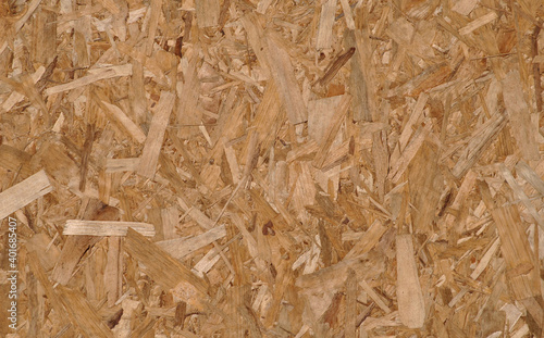 Textura de uma tábua fabricada com pedaços e lascas de sobras de madeira. 