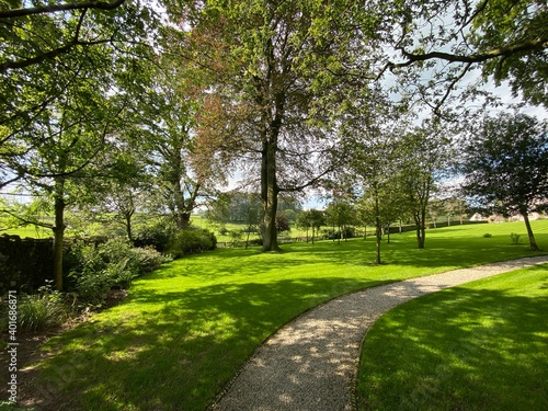 A footpath through parkland, in the old village of, Slaidburn, Clitheroe, UK