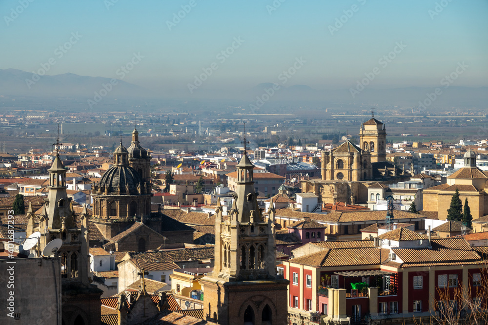 View of Granada (Spain) with the bell tower of several churches of the city one sunny morning