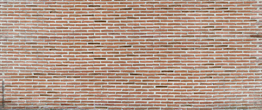 Panorama of an old red brick wall as a background or texture. Red brick wall. Texture of old dark brown and red brick wall panoramic backgorund. Panorama of an old red brick wall as a background or texture. Red brick wall. Texture of old dark brown and red brick wall panoramic backgorund.