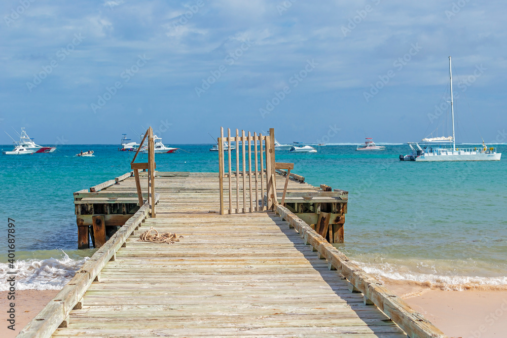 Old wooden pier and yachts, Punta Cana, Dominican Republic