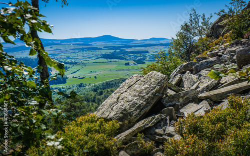 Hiking to the top of the Lizieux Peak (pic du Lizieux) with view of the rural landscape, and remains of former volcanoes photo