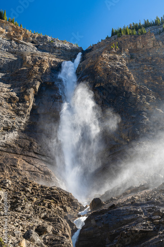 Takakkaw Falls Waterfall in a sunny summer day. 2nd tallest waterfall in Canada. Natural scenery landscape in Yoho National Park  Canadian Rockies  British Columbia.