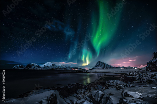 Fotografija Aurora Borealis on sky in Flakstad island, Lofoten archipelago
