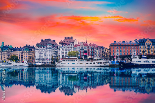 Strandvagen boulevard with boats and historic buildings at colorful sunset in stockholm sweden