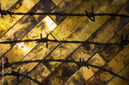 Textured grunge copper background with barbed wire