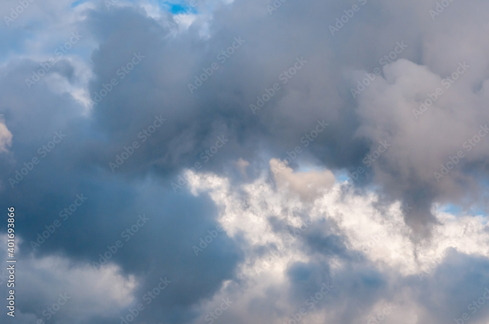Beautiful cumulus clouds of different colors in the sky Beautiful cumulus clouds of different colors in the sky