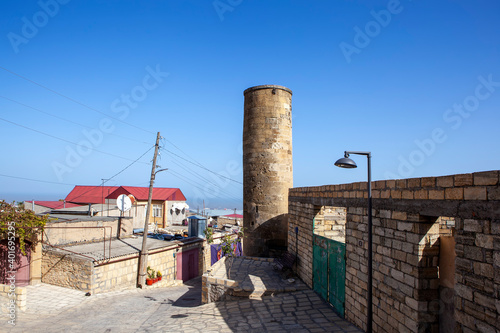 An old city street overlooking the Minaret-Mosque (XIII - XV centuries). Derbent. The Republic of Dagestan. Russia photo