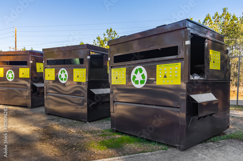 Fotografie Single stream recycle center collection bins at local trash dump