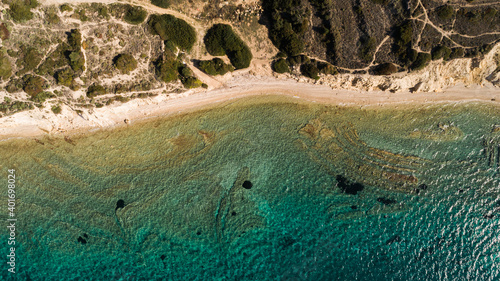 Top view aerial image from drone of an stunning beautiful sea landscape beach with turquoise water with copy space for your text.Beautiful Sand beach with turquoise water. Cesme Izmir Turkey photo