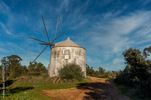 Old windmill in the middle of the mountain forest. Portuguese windmills called Moinhos da Pena